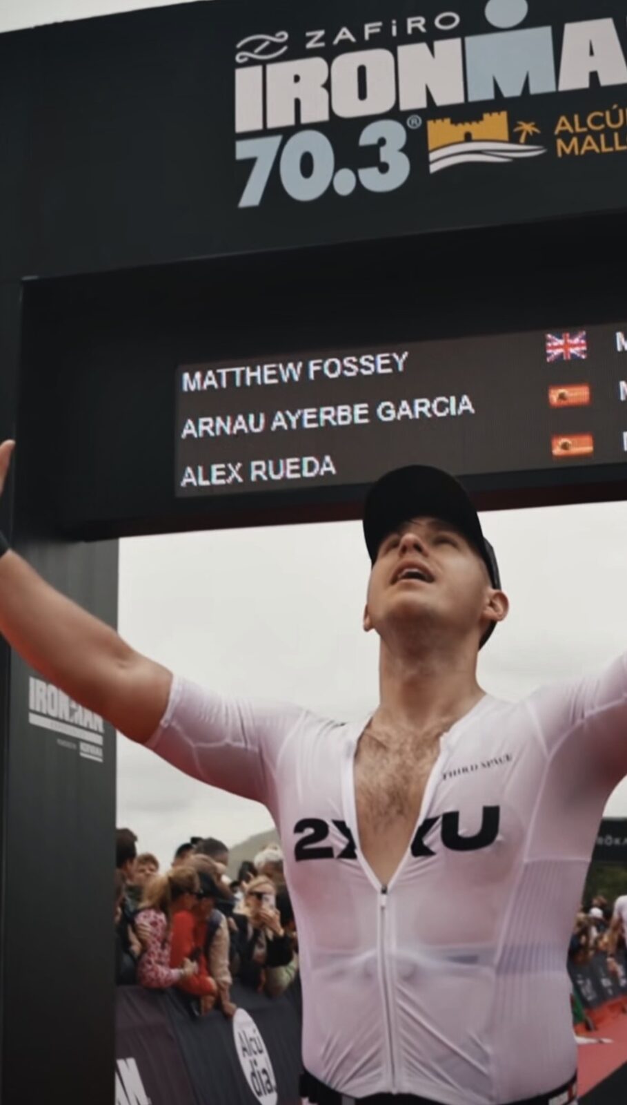 Matt Fossey crossing the finish line at Ironman 70.3 Alcúdia, Mallorca